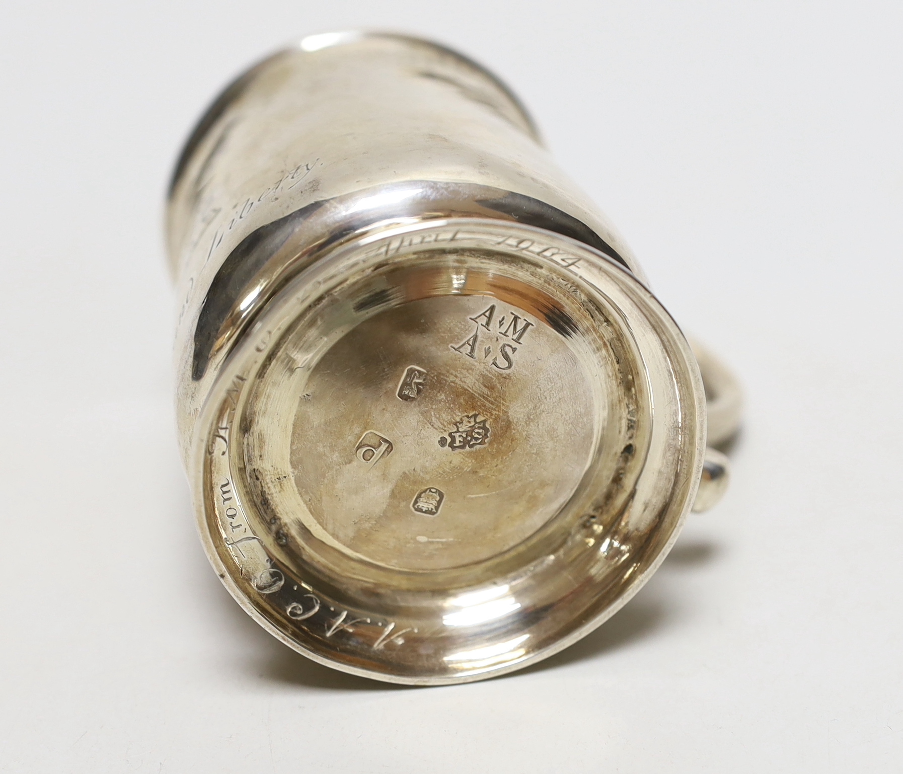 A George II silver half pint mug, engraved with a crest and the motto 'Beef and Liberty', makers mark rubbed, London 1730, 9.5cm, 194 grams